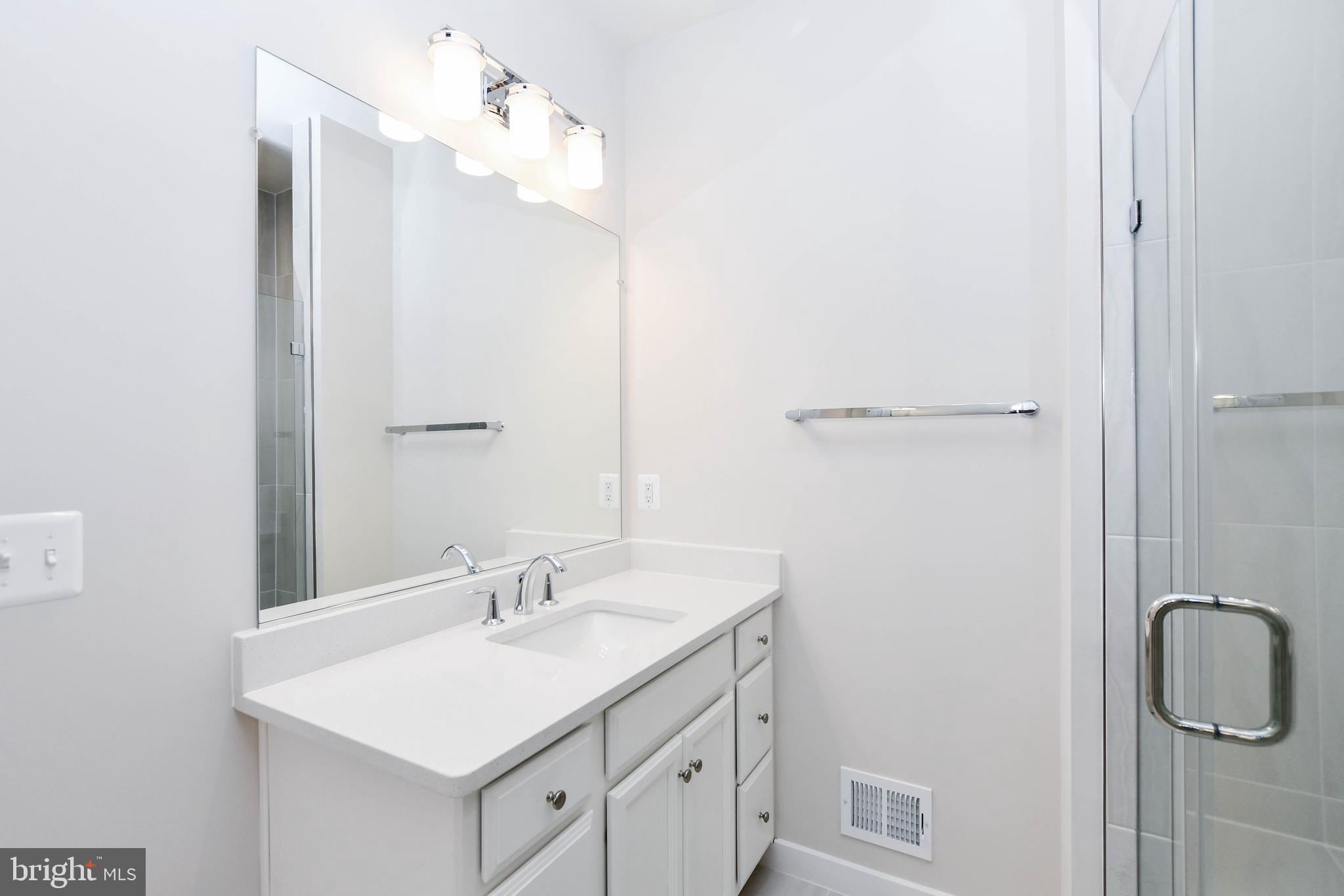44502 Wolfhound Square Ashburn, VA 20147 - Photo 37 of 100 a bathroom with a sink vanity and a mirror