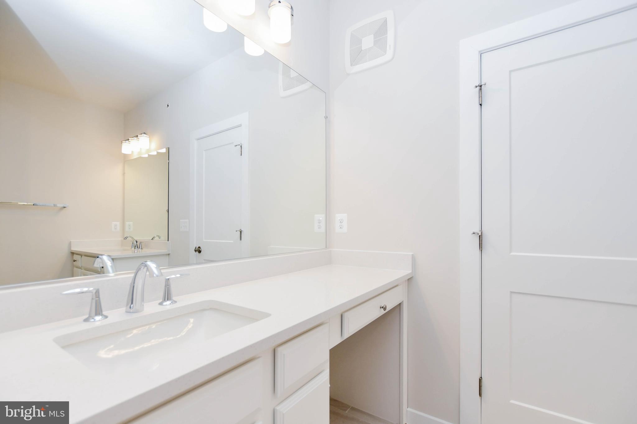 44502 Wolfhound Square Ashburn, VA 20147 - Photo 38 of 100 a bathroom with a sink and a mirror