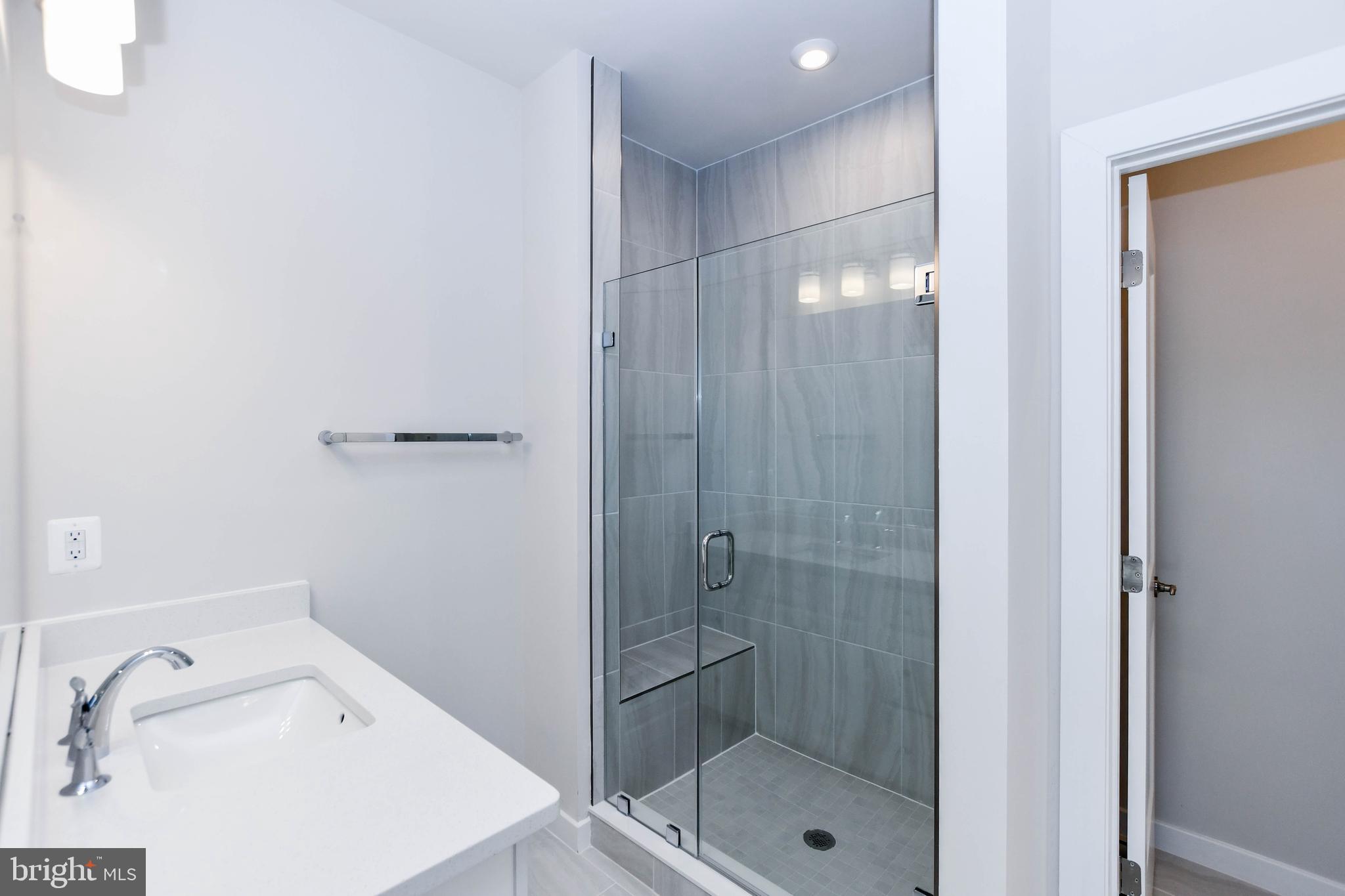 44502 Wolfhound Square Ashburn, VA 20147 - Photo 40 of 100 a bathroom with a shower and toilet