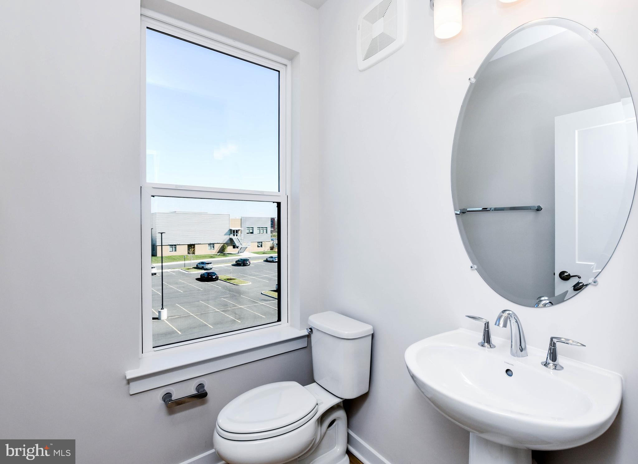 44502 Wolfhound Square Ashburn, VA 20147 - Photo 47 of 100 a bathroom with a sink mirror and toilet