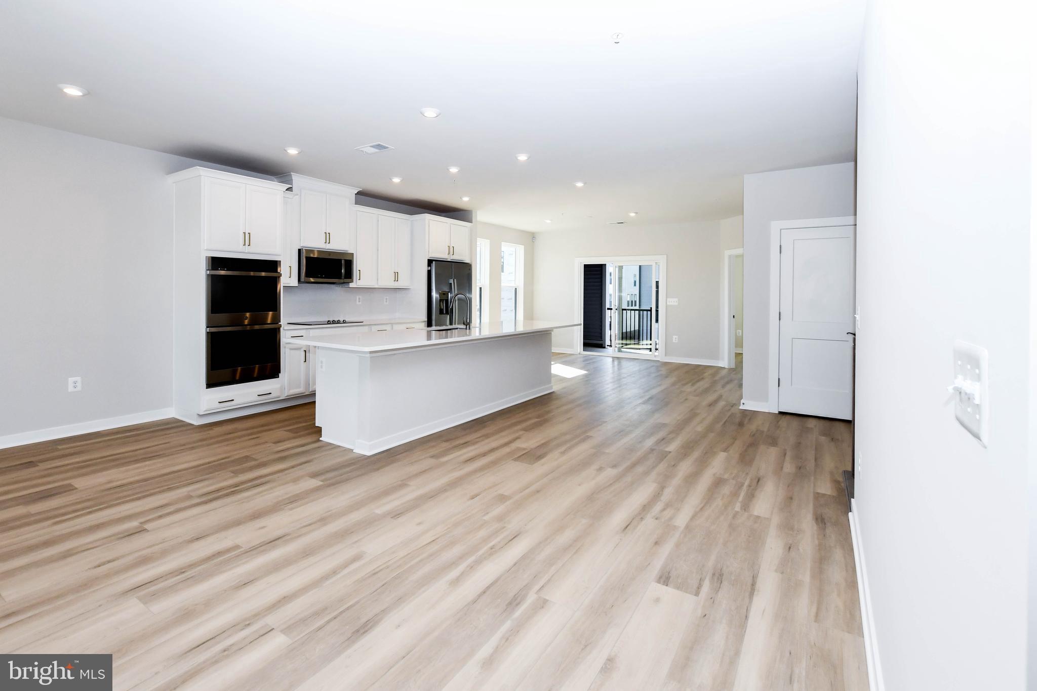 44502 Wolfhound Square Ashburn, VA 20147 - Photo 61 of 100 a view of a kitchen with wooden floor and electronic appliances