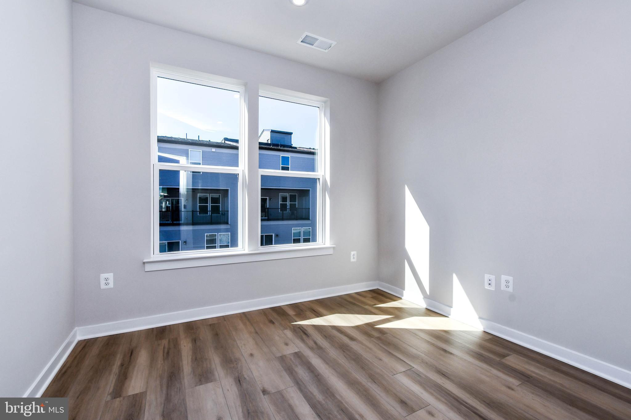 44502 Wolfhound Square Ashburn, VA 20147 - Photo 62 of 100 an empty room with wooden floor and windows