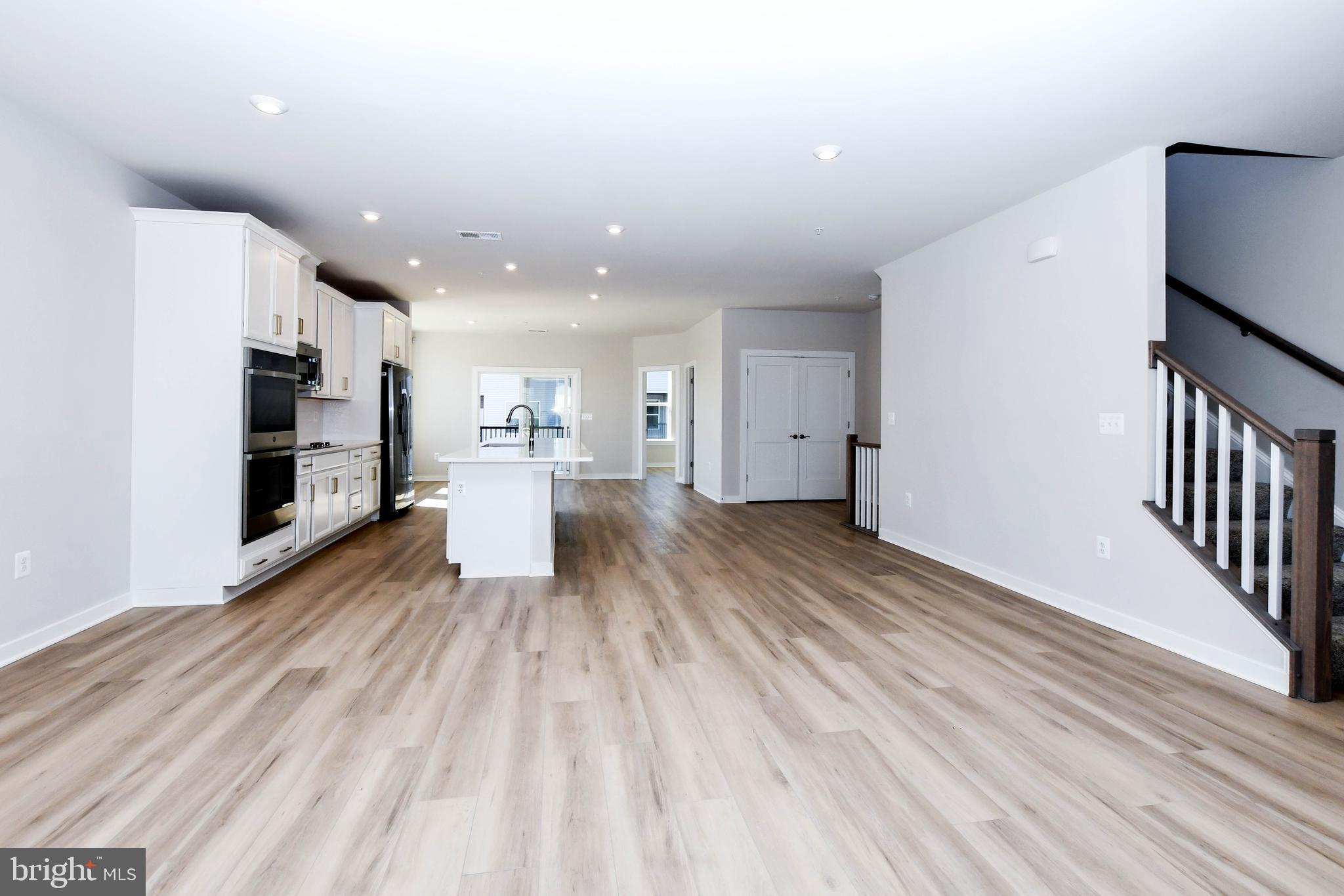 44502 Wolfhound Square Ashburn, VA 20147 - Photo 69 of 100 a view of a living room with stainless steel appliances wooden floor and living room view