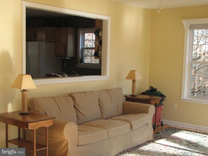 11522 Wrangler Road Lusby, MD 20657 - Photo 7 of 17 Living Room with Opening into Kitchen