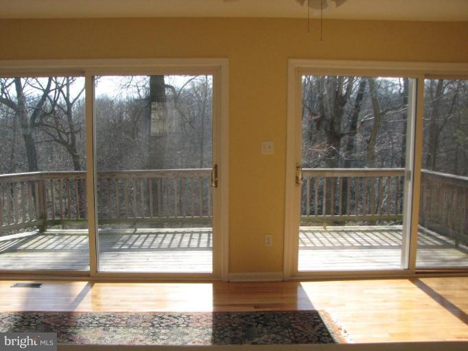 11522 Wrangler Road Lusby, MD 20657 - Photo 10 of 17 Taken at Passthru into living room and outside