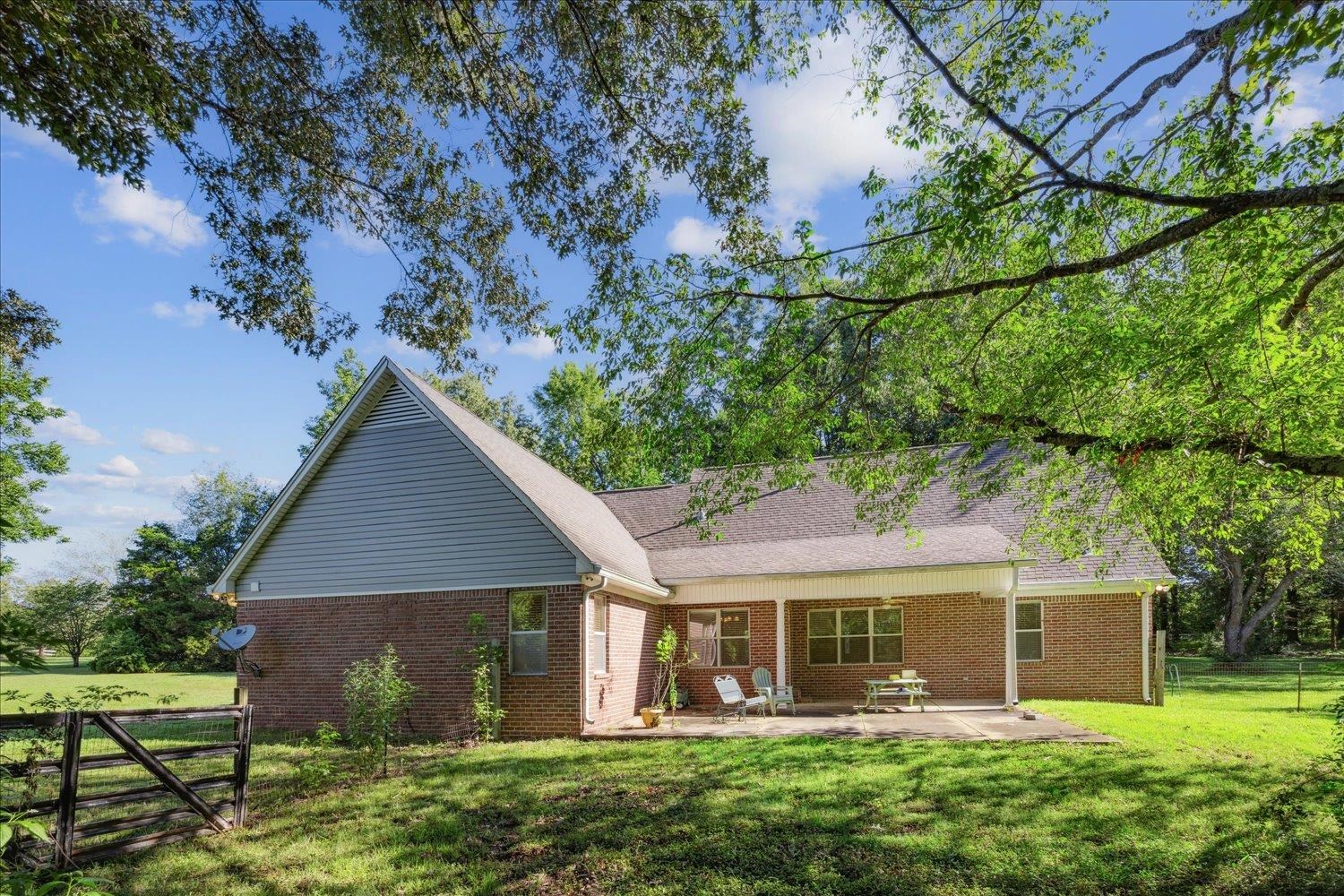 6473 Pleasant Ridge Road Millington, TN 38053 - Photo 19 of 23 Exterior space with a patio and a yard