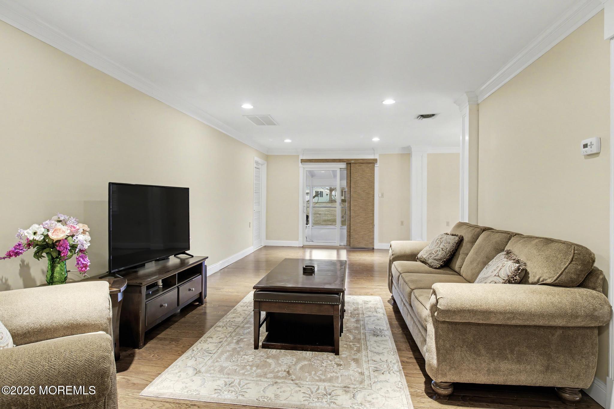 203 Blake Circle Brick, NJ 08724 - Photo 11 of 40 a living room with furniture and a flat screen tv