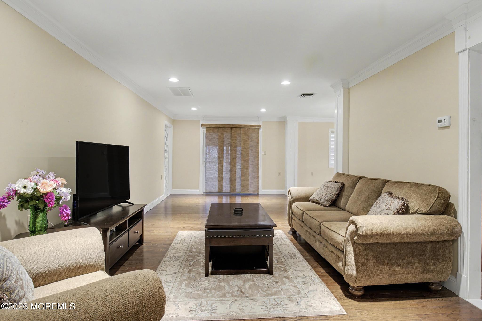 203 Blake Circle Brick, NJ 08724 - Photo 12 of 40 a living room with furniture and a flat screen tv