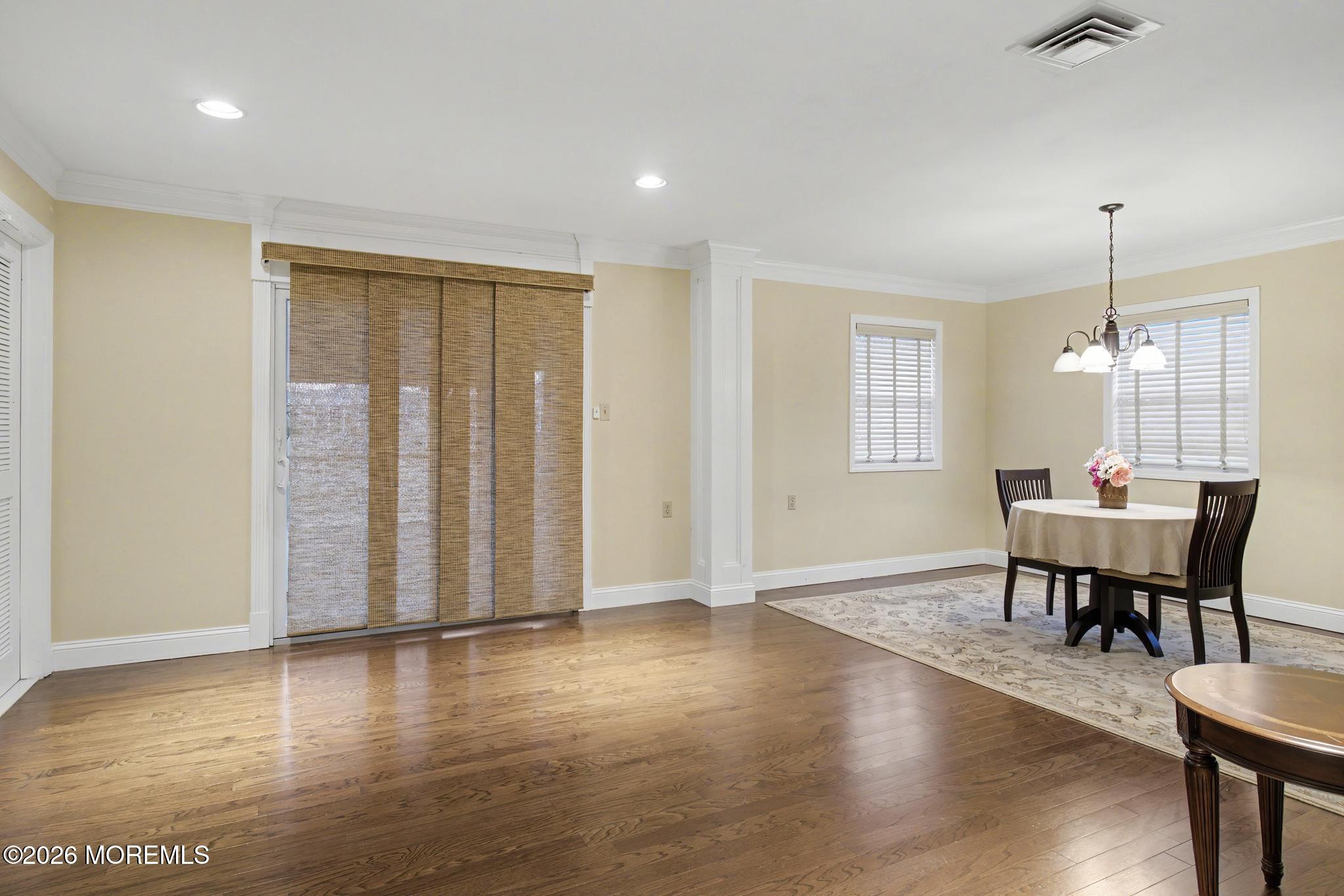 203 Blake Circle Brick, NJ 08724 - Photo 13 of 40 a view of a dining room with furniture and wooden floor