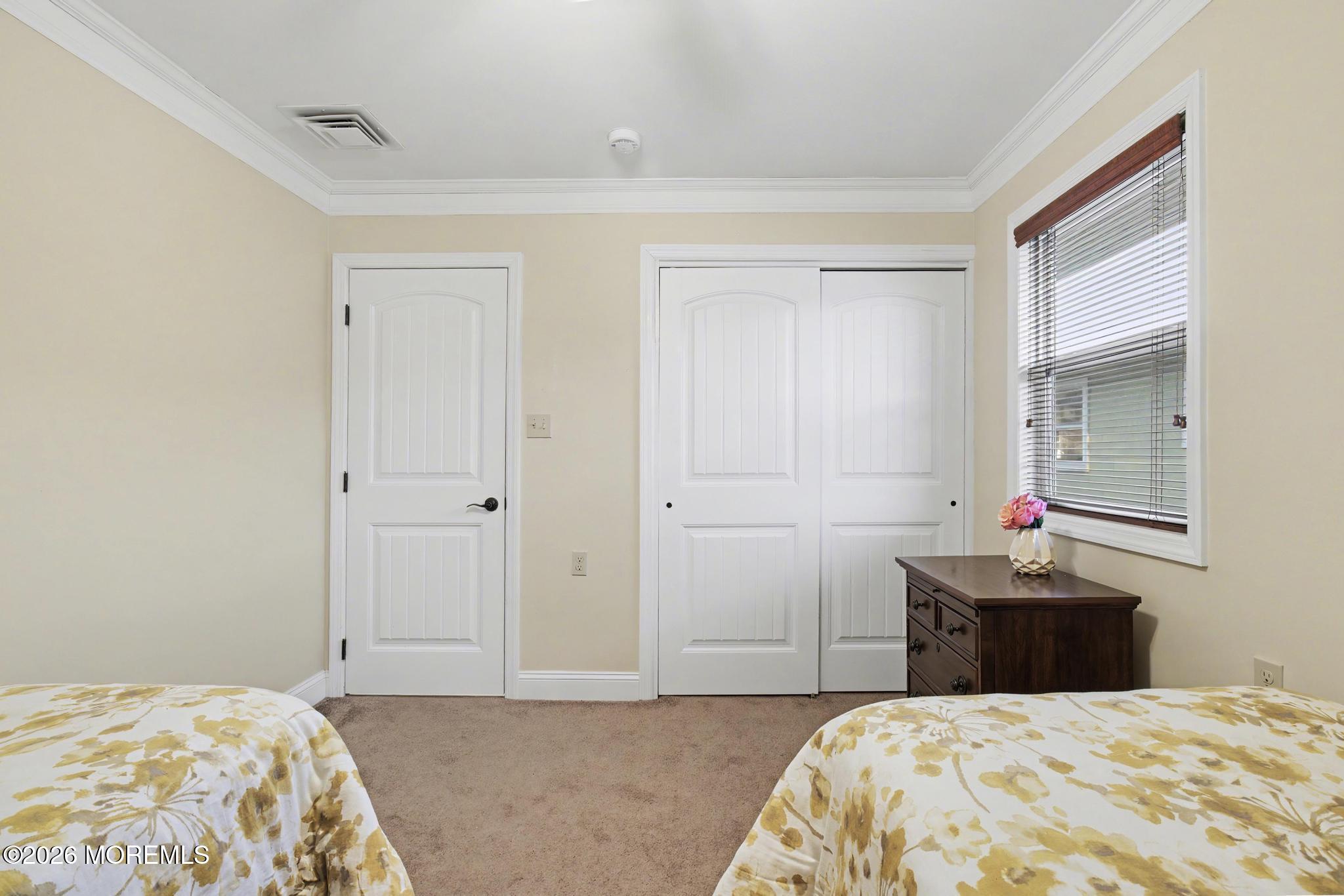 203 Blake Circle Brick, NJ 08724 - Photo 23 of 40 a bedroom with a bed and window