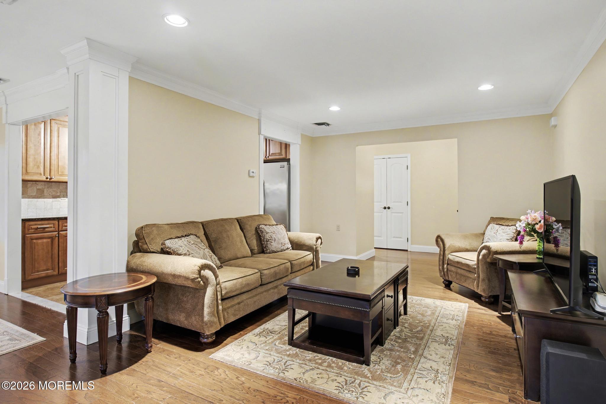 203 Blake Circle Brick, NJ 08724 - Photo 9 of 40 a living room with furniture and a flat screen tv