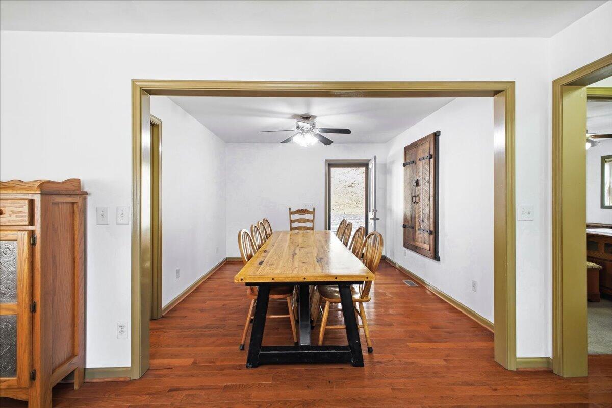 3282 Absalom Smith Road Salem, VA 24153 - Photo 13 of 59 a view of a dining room with furniture window and wooden floor