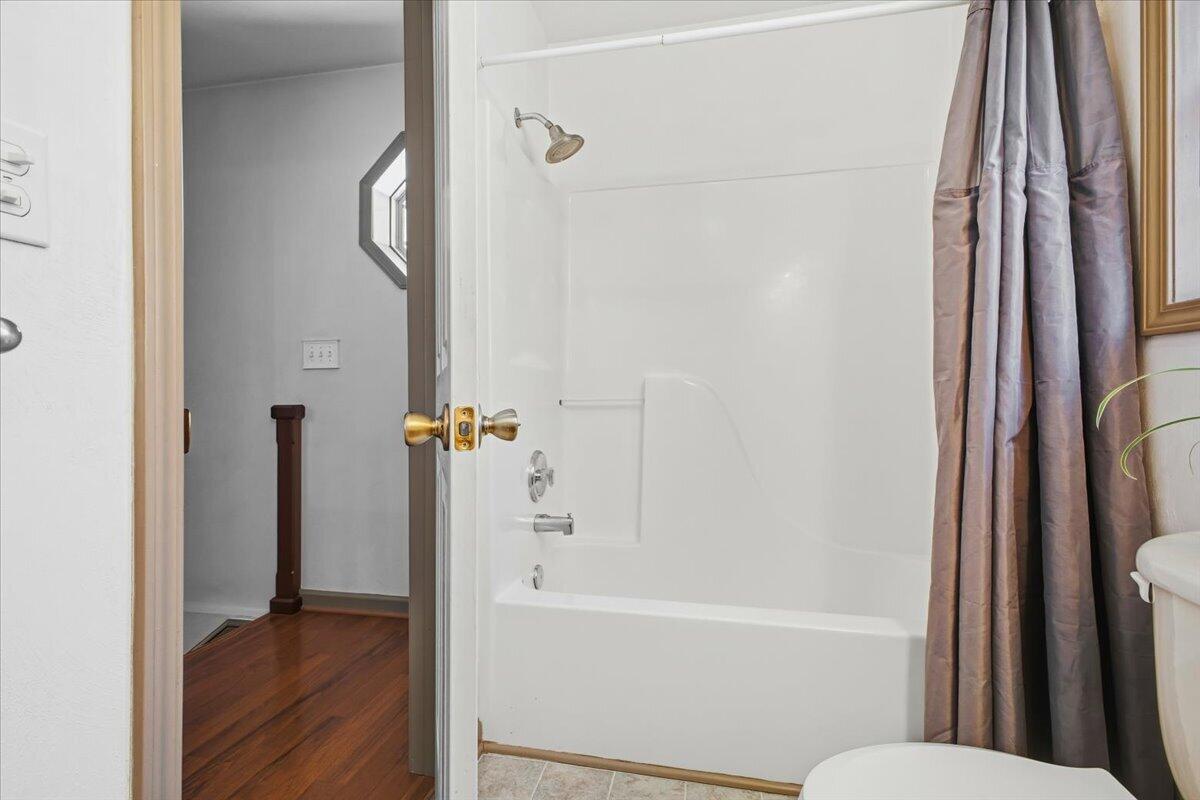 3282 Absalom Smith Road Salem, VA 24153 - Photo 17 of 59 a bathroom with a bathtub and a shower