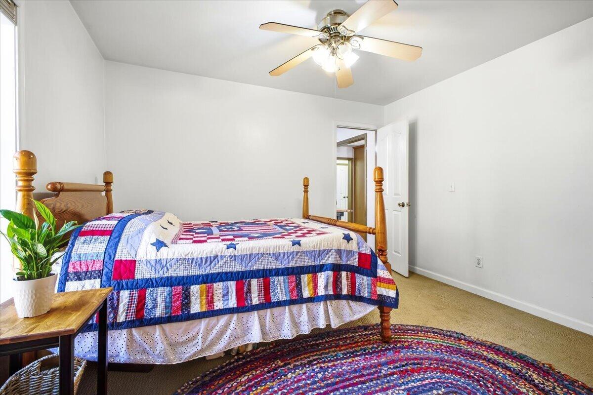 3282 Absalom Smith Road Salem, VA 24153 - Photo 18 of 59 a bedroom with a bed and a table in it