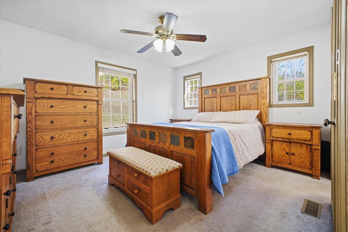 3282 Absalom Smith Road Salem, VA 24153 - Photo 20 of 59 a bedroom with a bed and a dresser
