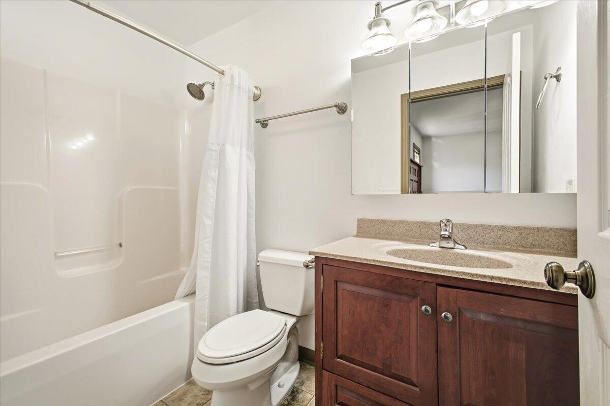 3282 Absalom Smith Road Salem, VA 24153 - Photo 22 of 59 a bathroom with a granite countertop sink toilet and shower