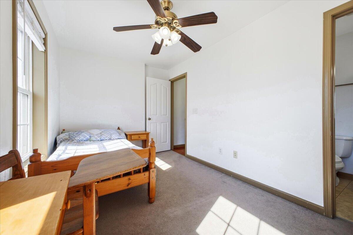 3282 Absalom Smith Road Salem, VA 24153 - Photo 24 of 59 a room with table and ceiling fan