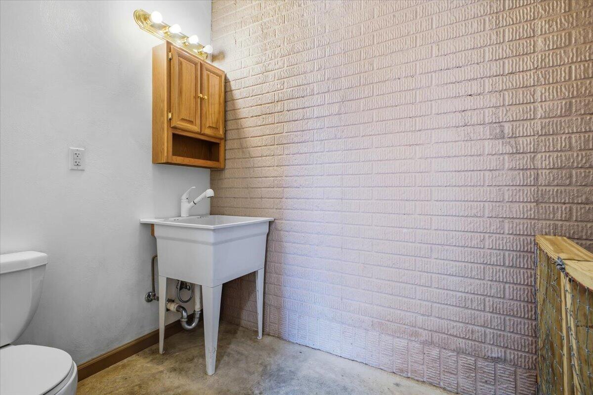 3282 Absalom Smith Road Salem, VA 24153 - Photo 25 of 59 a bathroom with a sink a toilet and mirror