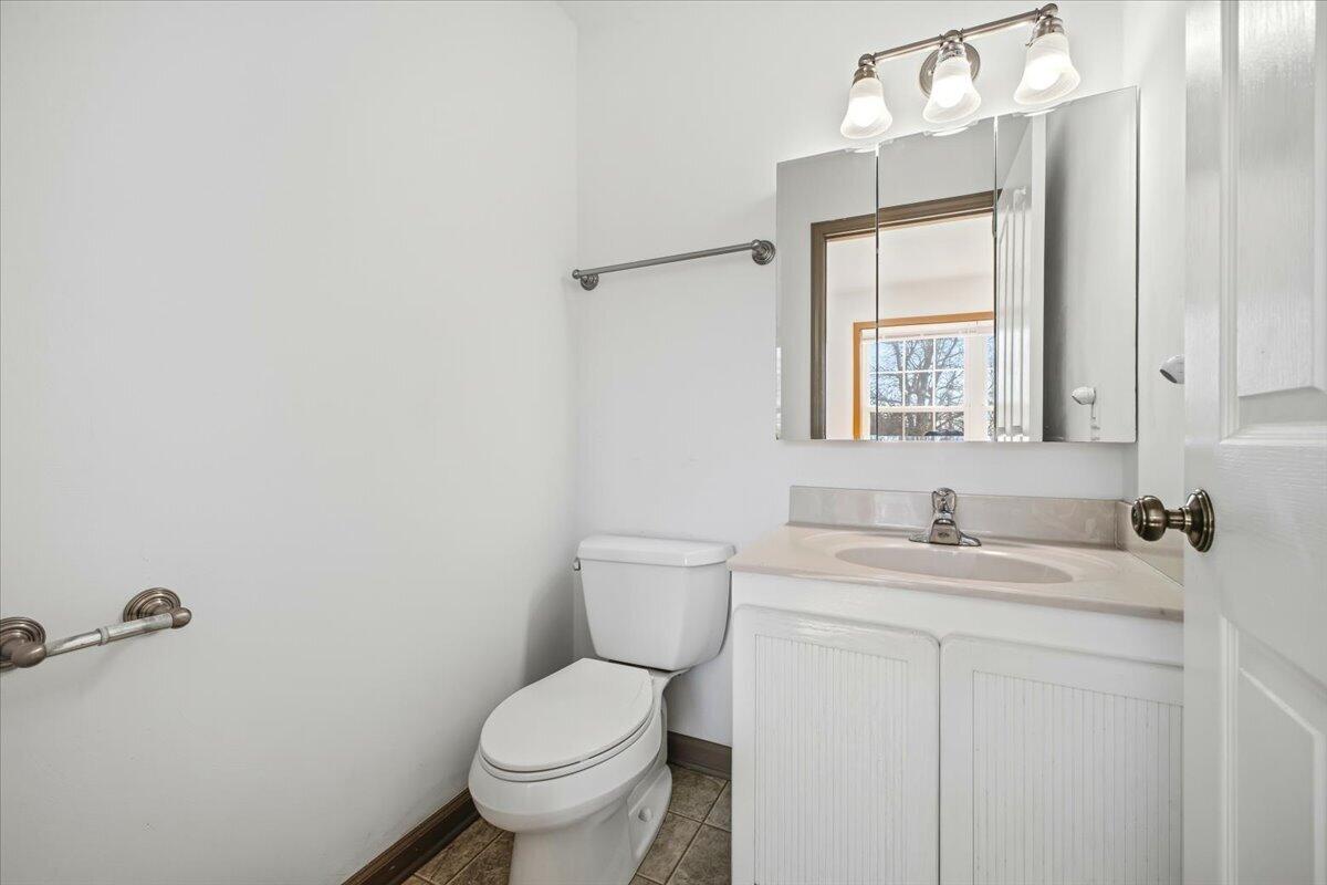 3282 Absalom Smith Road Salem, VA 24153 - Photo 27 of 59 a bathroom with a toilet sink and mirror