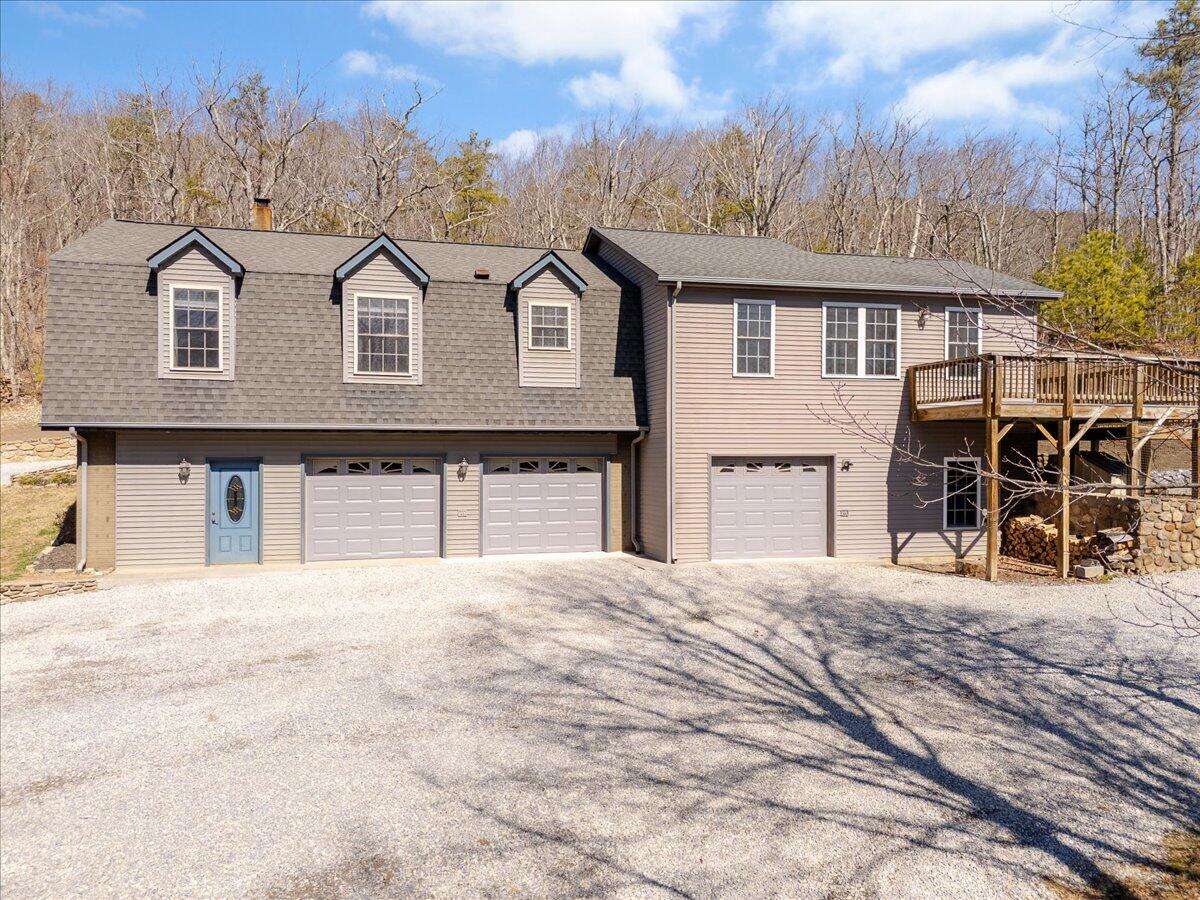 3282 Absalom Smith Road Salem, VA 24153 - Photo 3 of 59 a front view of a house with large trees