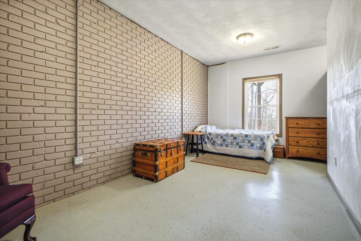 3282 Absalom Smith Road Salem, VA 24153 - Photo 32 of 59 a bedroom with a bed and a desk