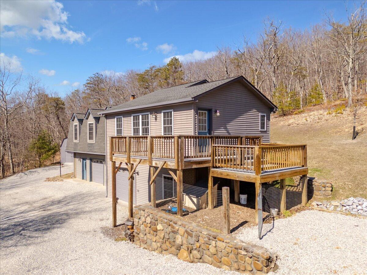 3282 Absalom Smith Road Salem, VA 24153 - Photo 4 of 59 a view of a house with wooden fence next to a road
