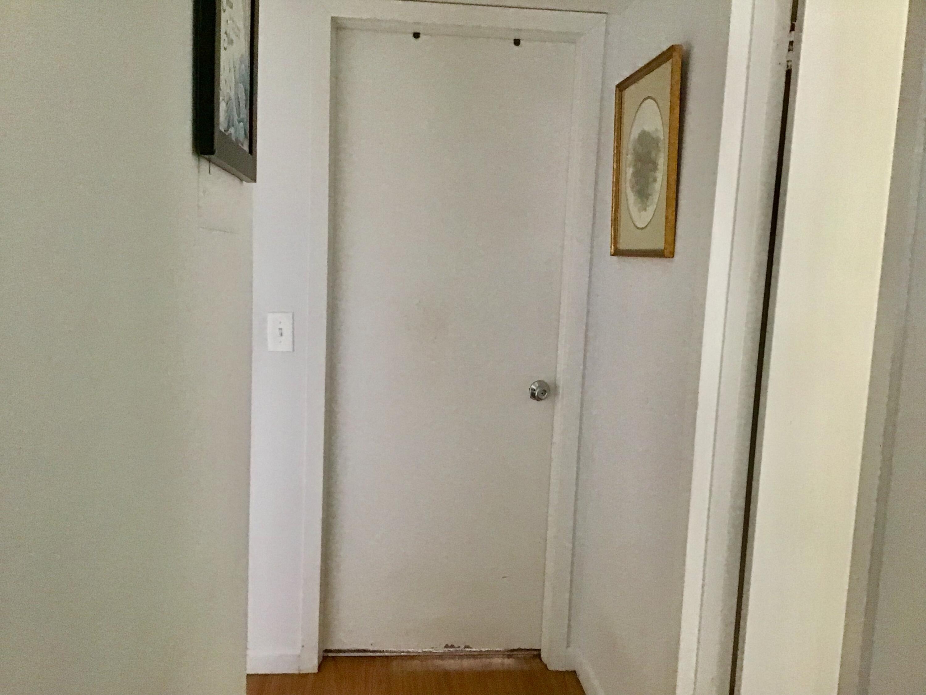 84 Brighton B Boca Raton, FL 33434 - Photo 14 of 35 a view of a hallway with wooden floor