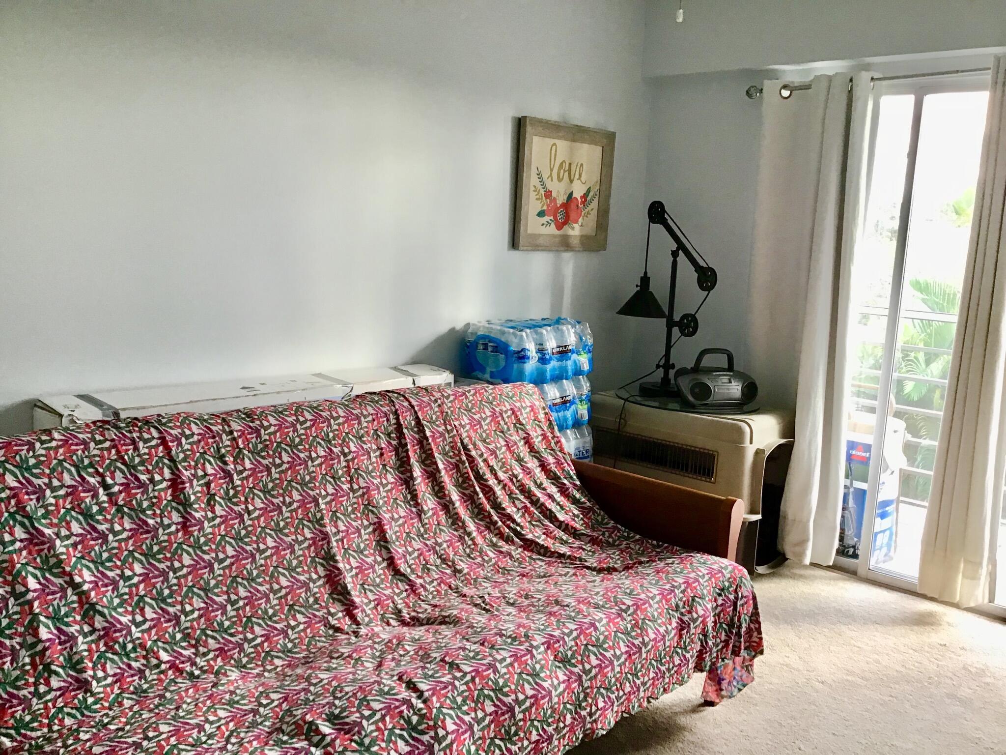 84 Brighton B Boca Raton, FL 33434 - Photo 18 of 35 a bedroom with a bed and a dresser next to a window