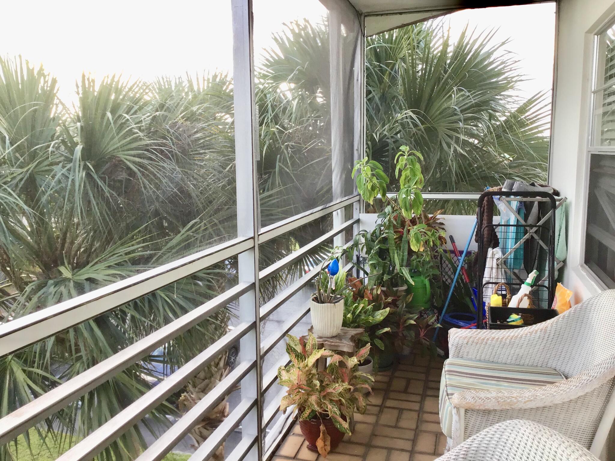 84 Brighton B Boca Raton, FL 33434 - Photo 20 of 35 a view of a balcony with chairs and a potted plant