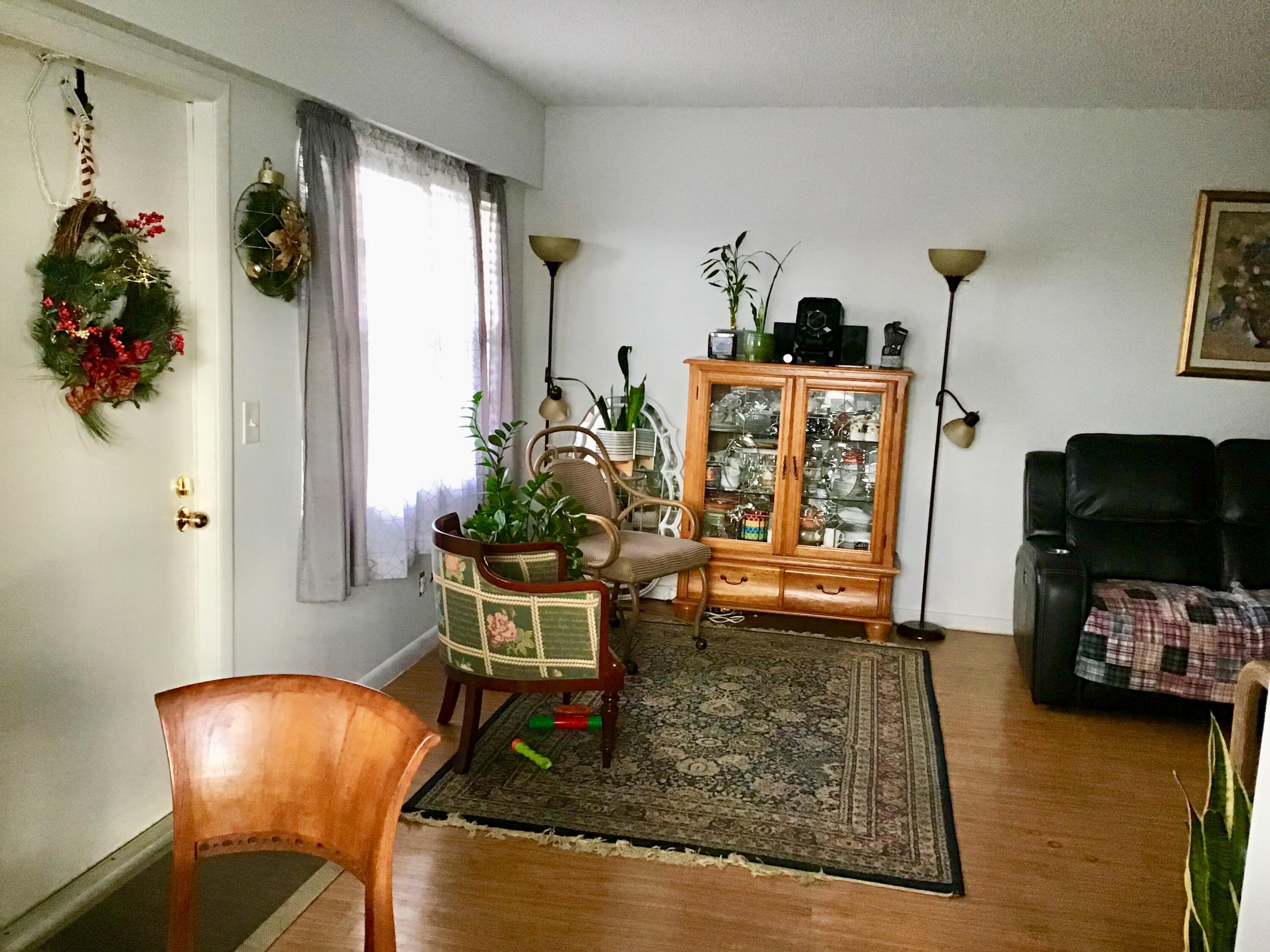 84 Brighton B Boca Raton, FL 33434 - Photo 2 of 35 a living room with furniture and a potted plant