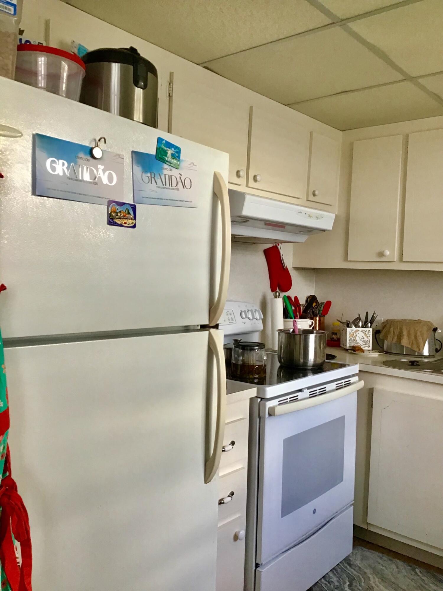 84 Brighton B Boca Raton, FL 33434 - Photo 4 of 35 a kitchen with stainless steel appliances a refrigerator sink and cabinets