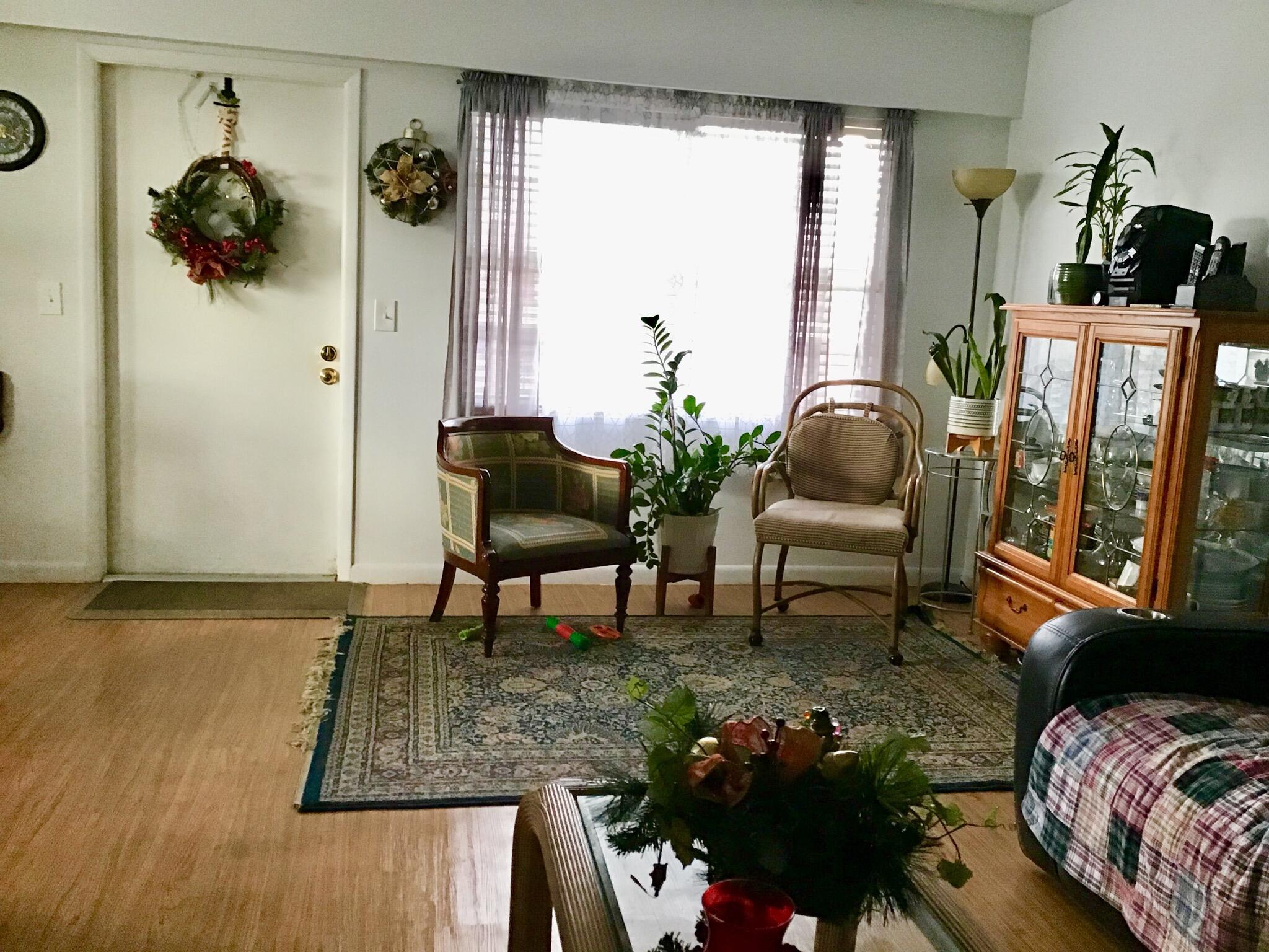 84 Brighton B Boca Raton, FL 33434 - Photo 10 of 35 a living room with furniture and a potted plant