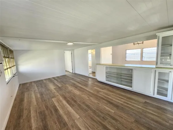 a view of an empty room with a window