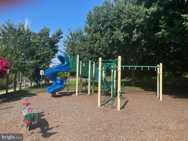 a backyard of a house with portable swimming pool and outdoor seating