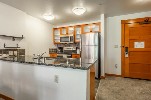 a kitchen with a stove and a microwave