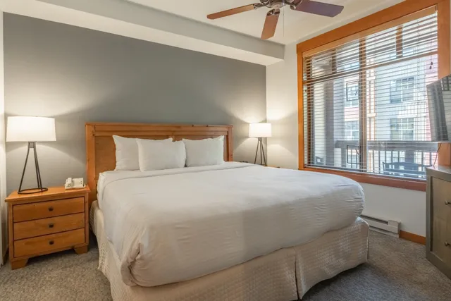 a kitchen with stainless steel appliances granite countertop a sink refrigerator and cabinets