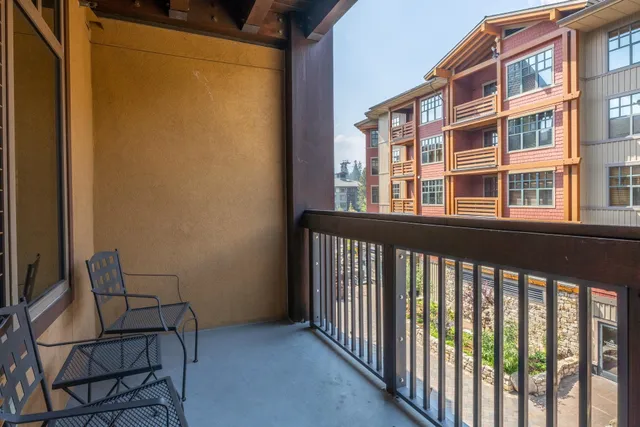 a bathroom with a granite countertop sink mirror and toilet