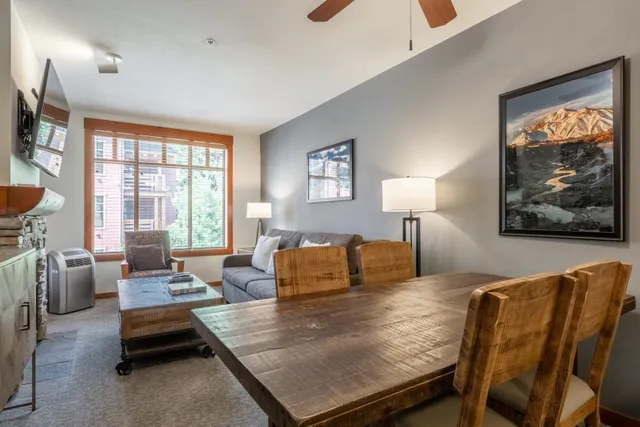a bedroom with furniture and a large window