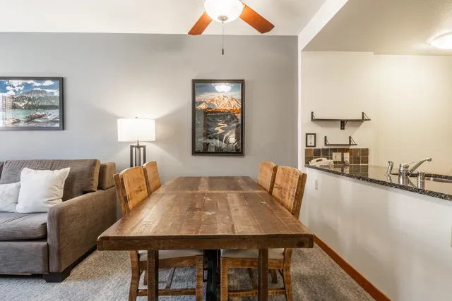 a living room with furniture and a table