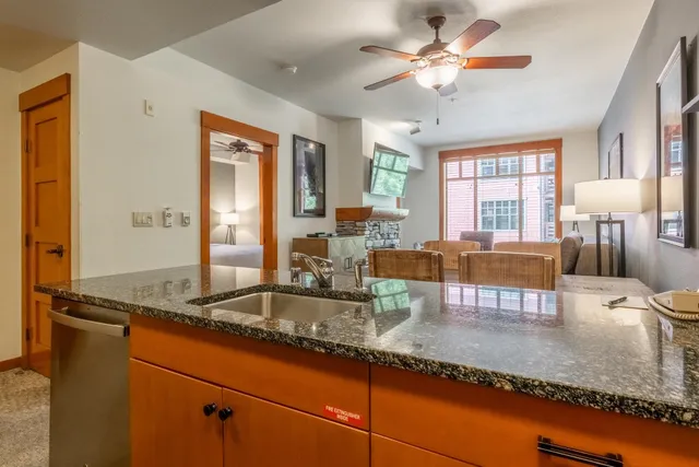 a view of swimming pool with outdoor seating and city view