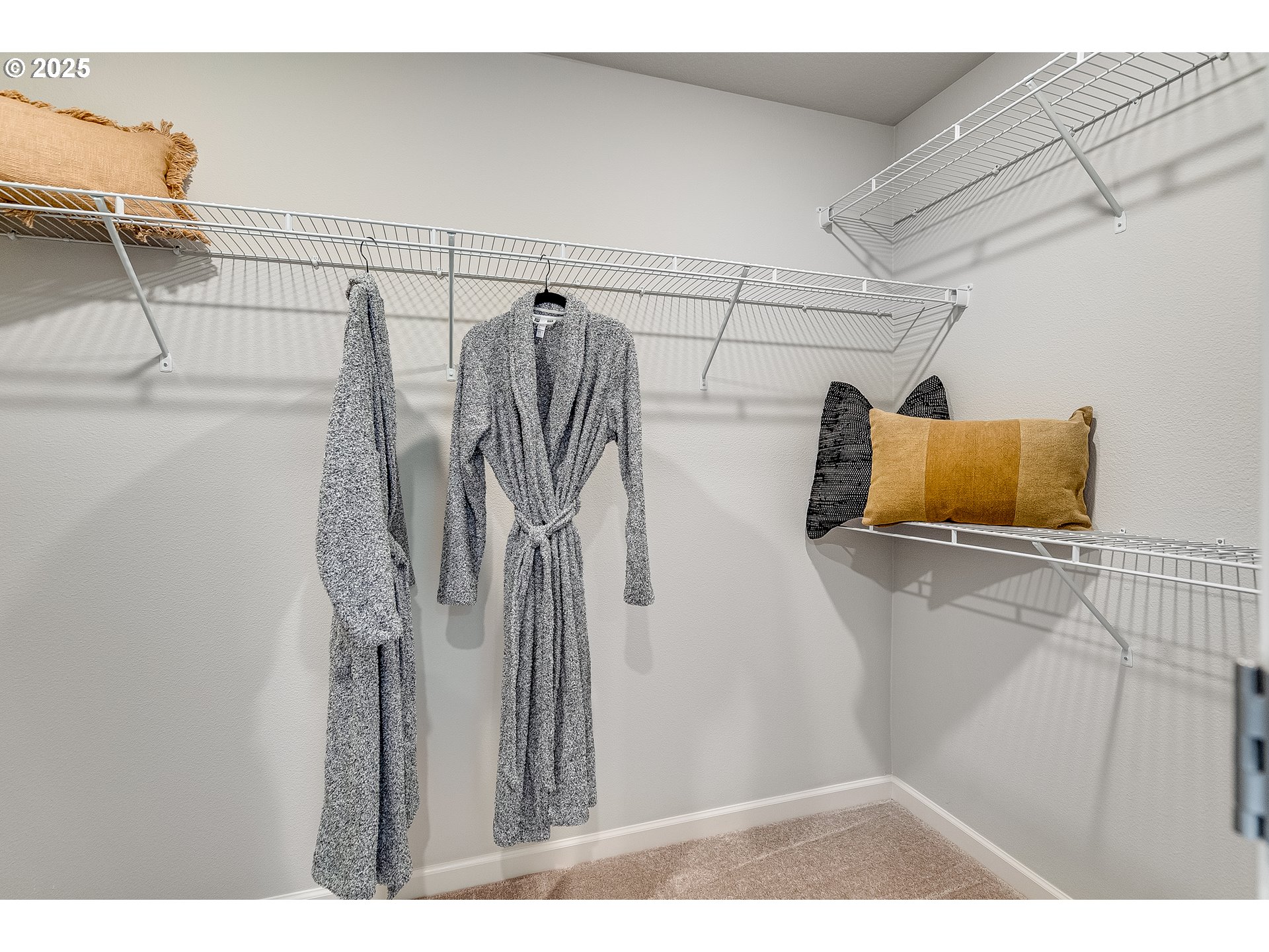 931 Legacy Street Eugene, OR 97402 - Photo 17 of 21 a view of walk in closet with clothes and shoes