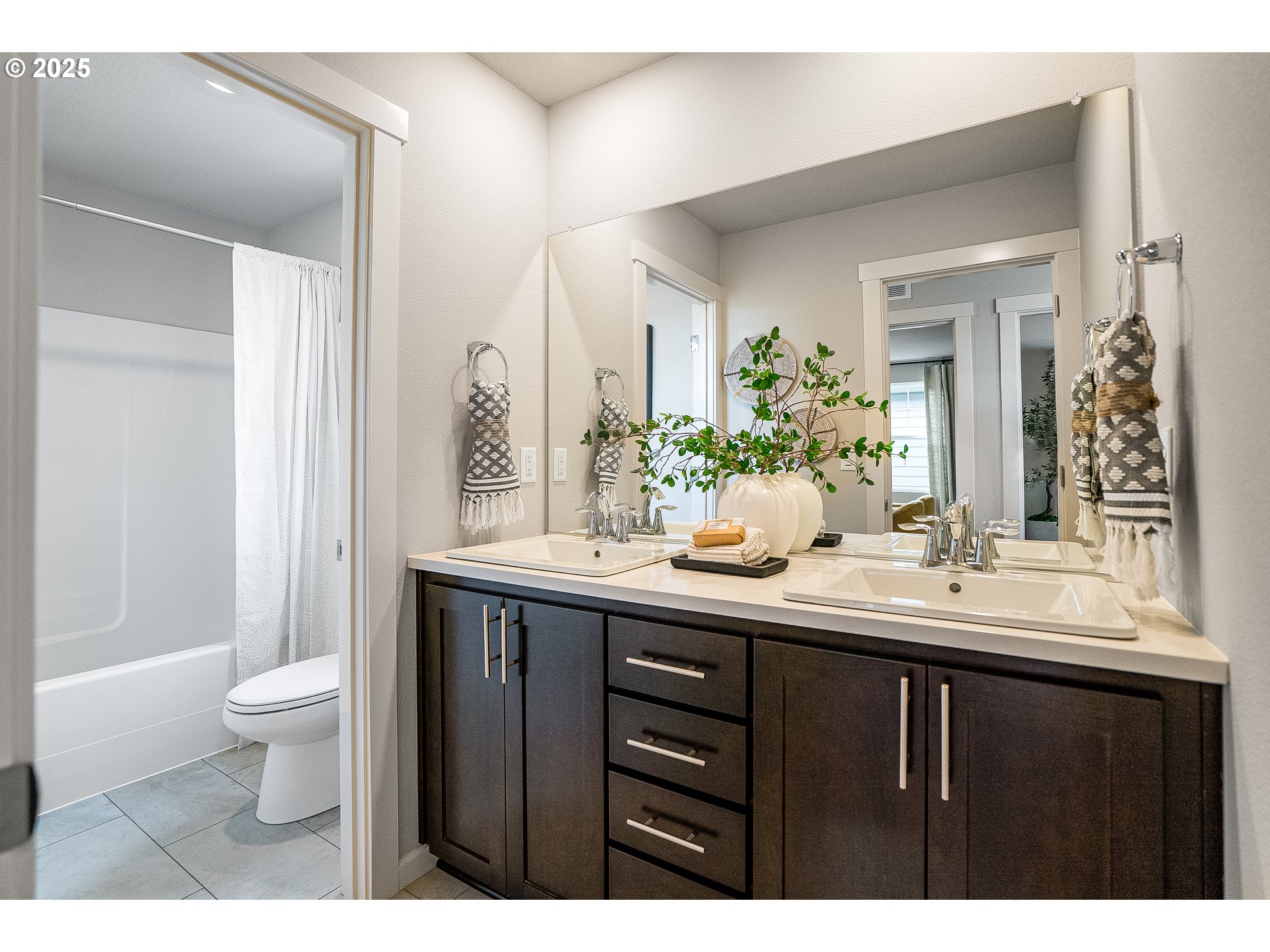 931 Legacy Street Eugene, OR 97402 - Photo 20 of 21 a bathroom with a double vanity sink toilet and a mirror