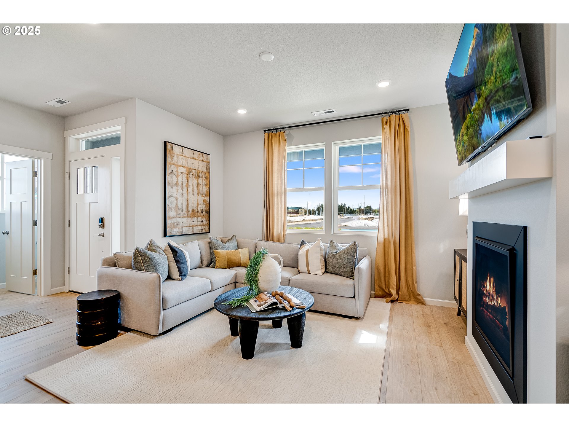 931 Legacy Street Eugene, OR 97402 - Photo 7 of 21 a living room with furniture flat screen tv and a fireplace
