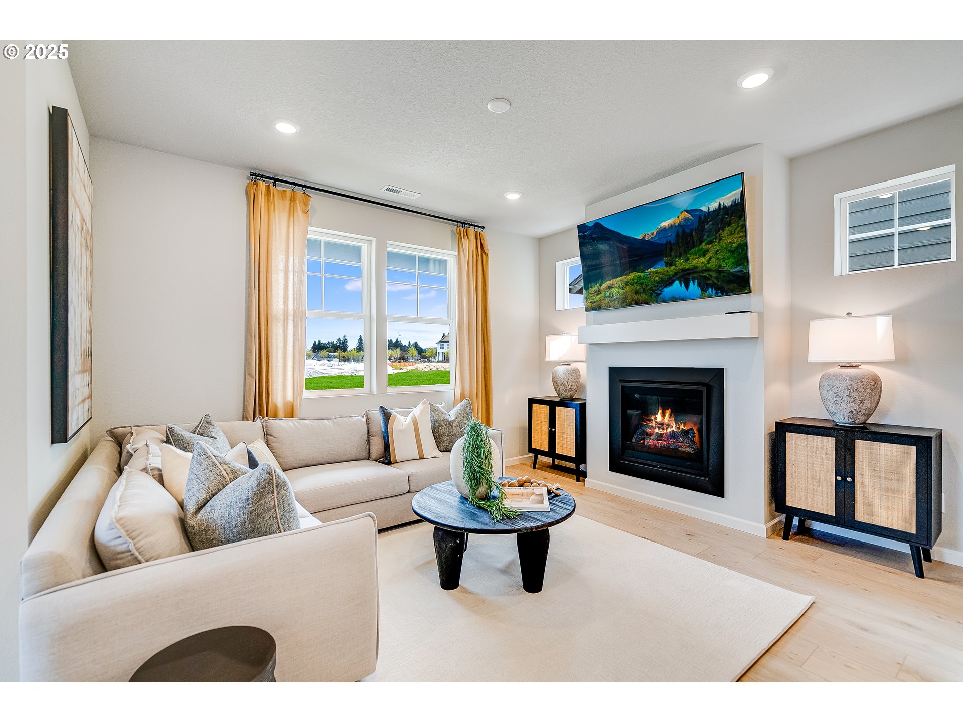 931 Legacy Street Eugene, OR 97402 - Photo 9 of 21 a living room with furniture a flat screen tv and a fireplace