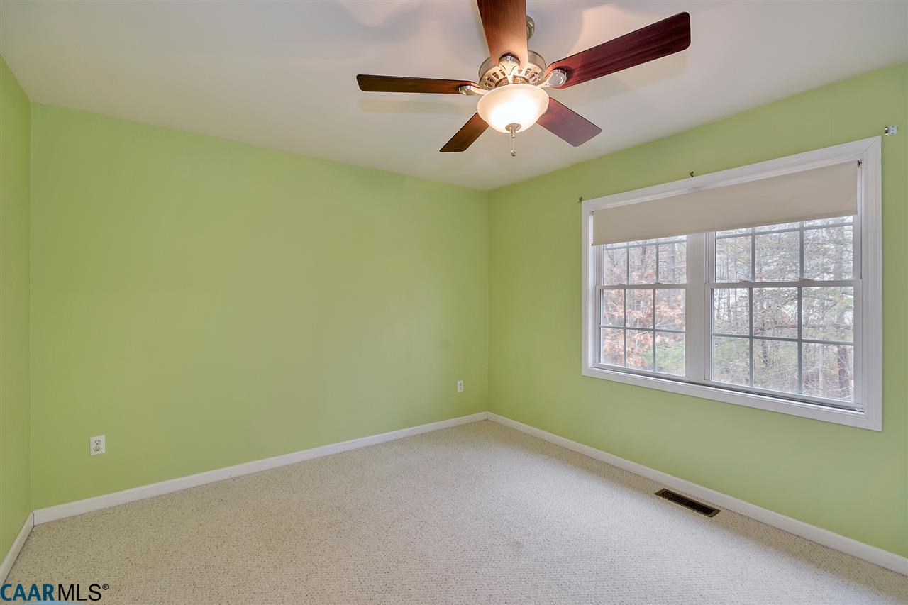 200 Doe Drive Ruckersville, VA 22968 - Photo 17 of 22 an empty room with a window and a fan