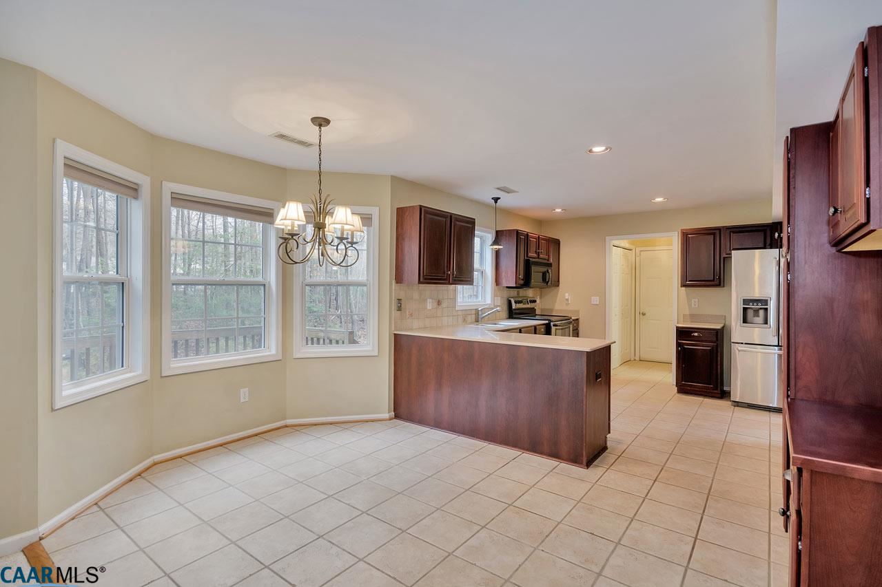 200 Doe Drive Ruckersville, VA 22968 - Photo 8 of 22 a large kitchen with a large counter top stainless steel appliances and cabinets