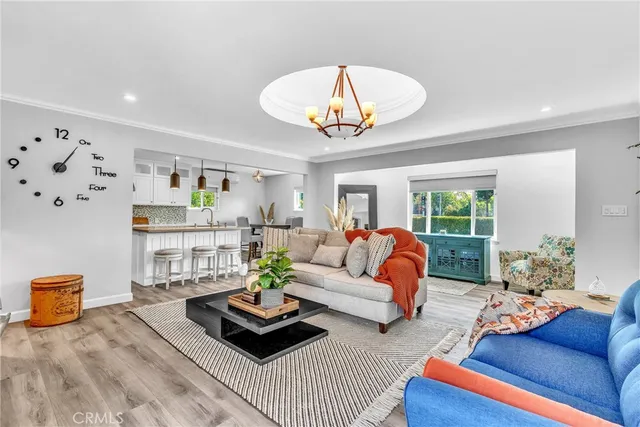 a living room with furniture rug and window