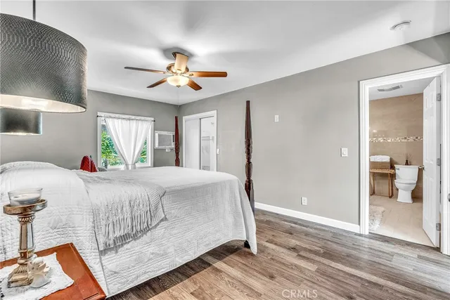 a bed room with a bed and a chandelier