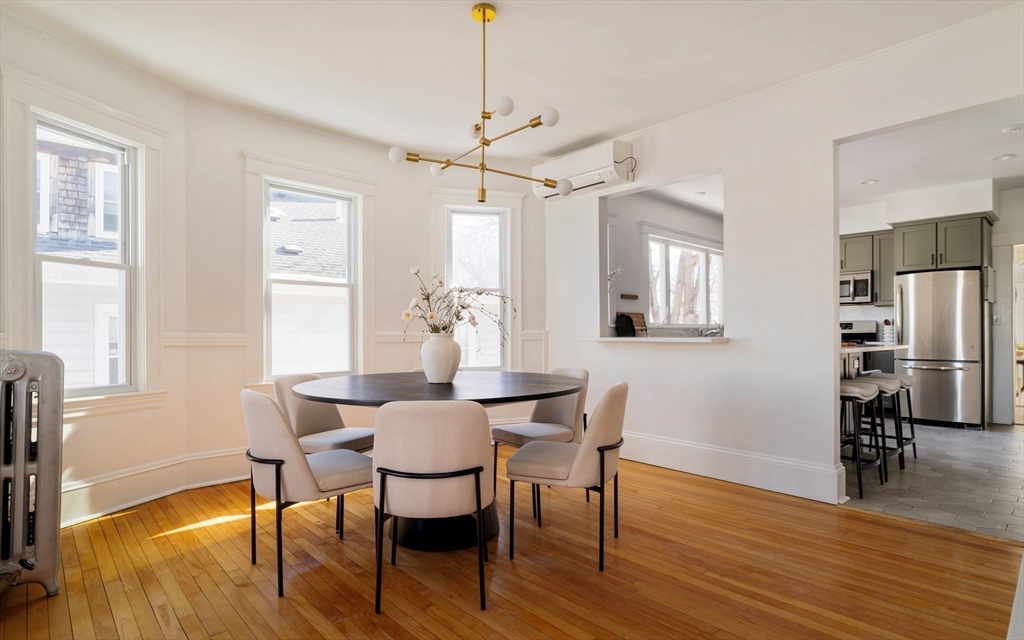 182 Maplewood Street, Unit 2 Watertown, MA 02472 - Photo 11 of 42 a view of a a dining room with furniture window and wooden floor
