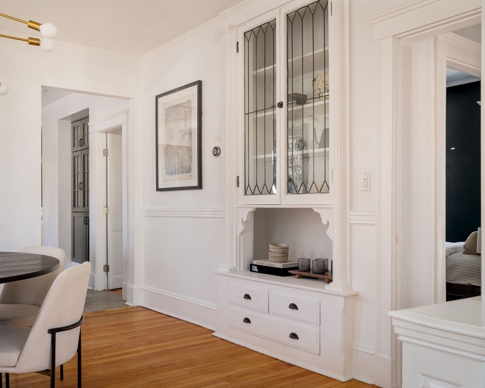 182 Maplewood Street, Unit 2 Watertown, MA 02472 - Photo 12 of 42 a living room with a bed furniture and a window